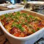 Salmon sushi bake with golden crispy top and garnishes